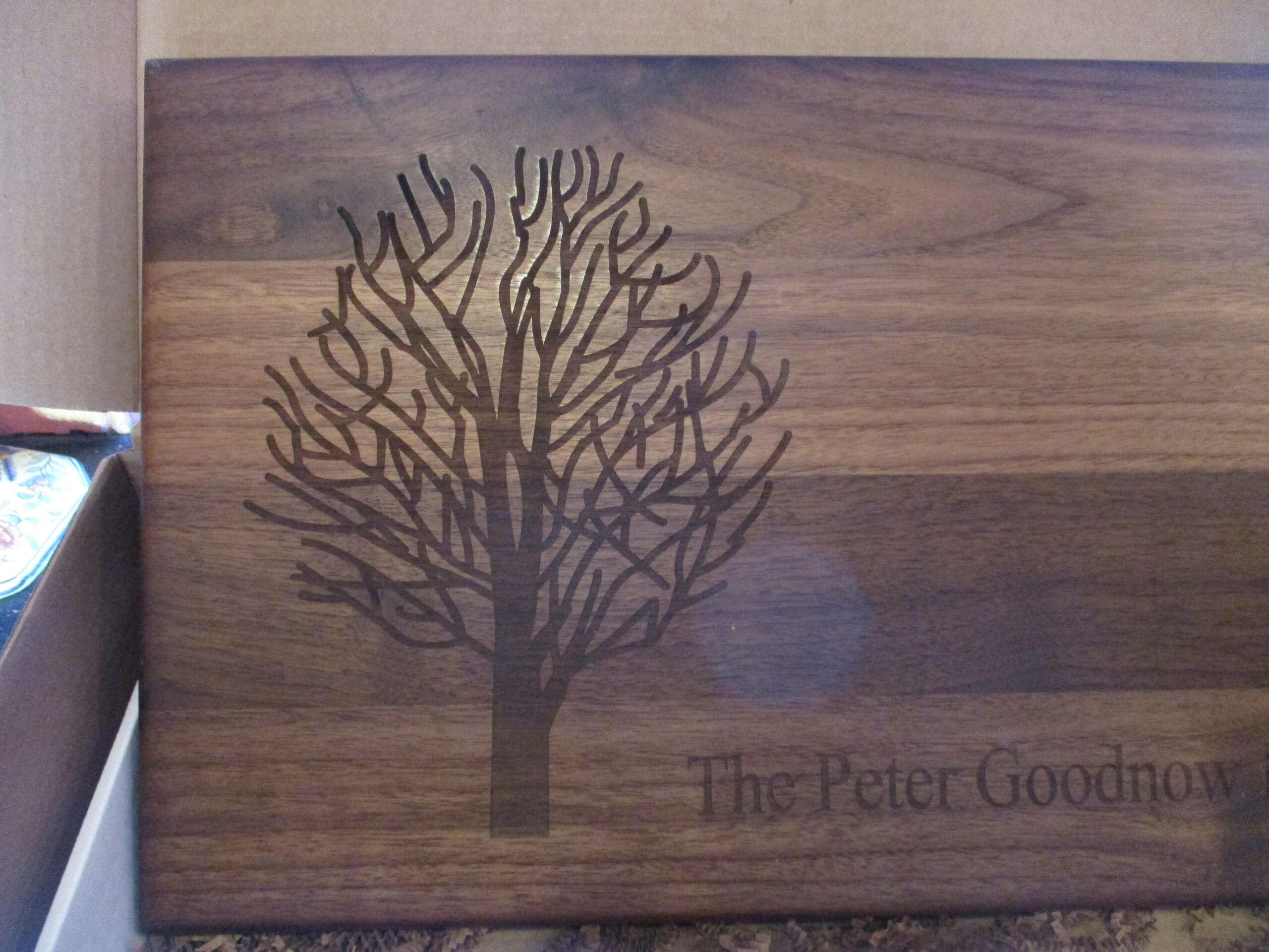 Custom engraved dry tree on walnut cutting board/charcuterie board as a closing gift for a client.