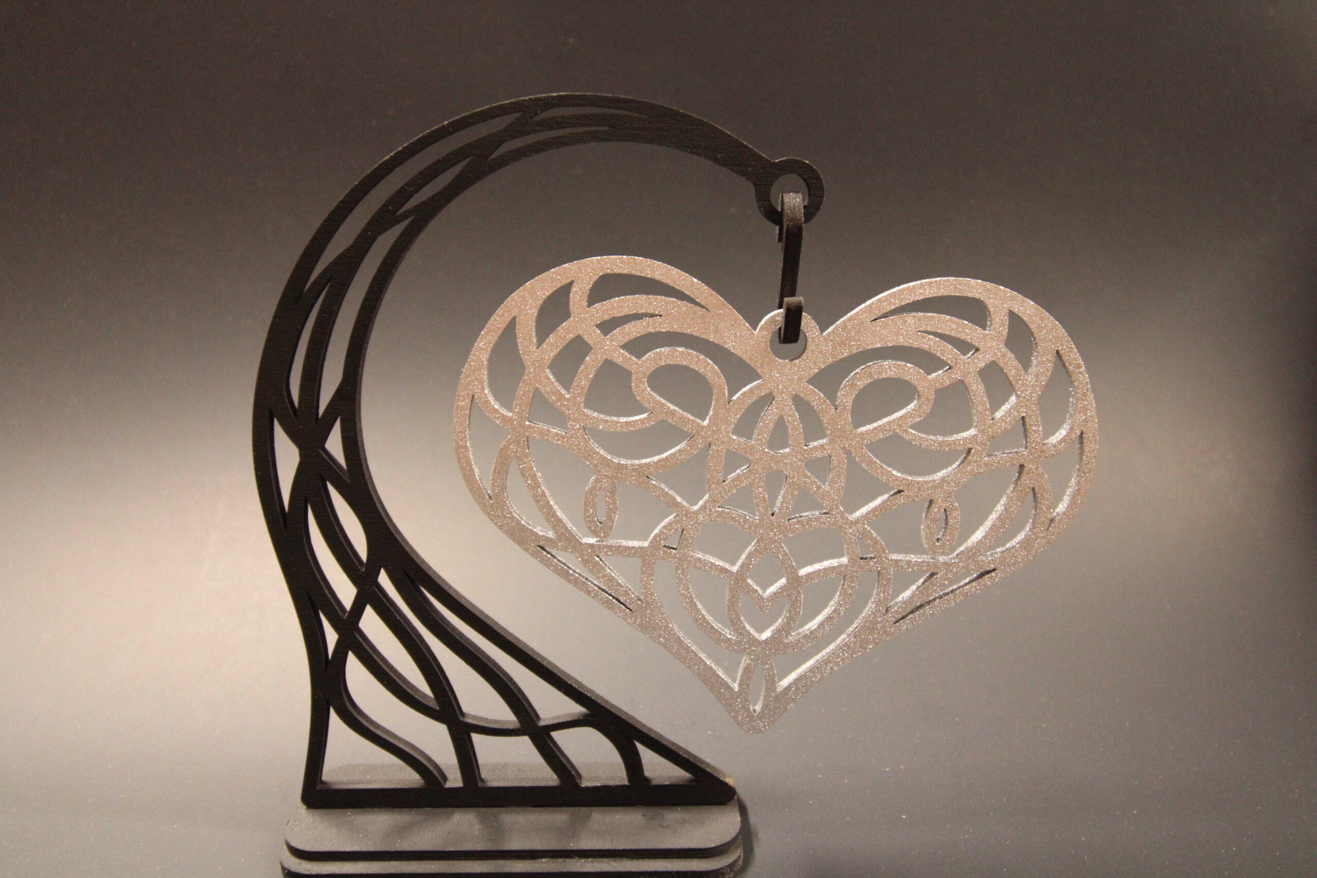 Custom laser cut silver heart for Valentine’s Day gift.