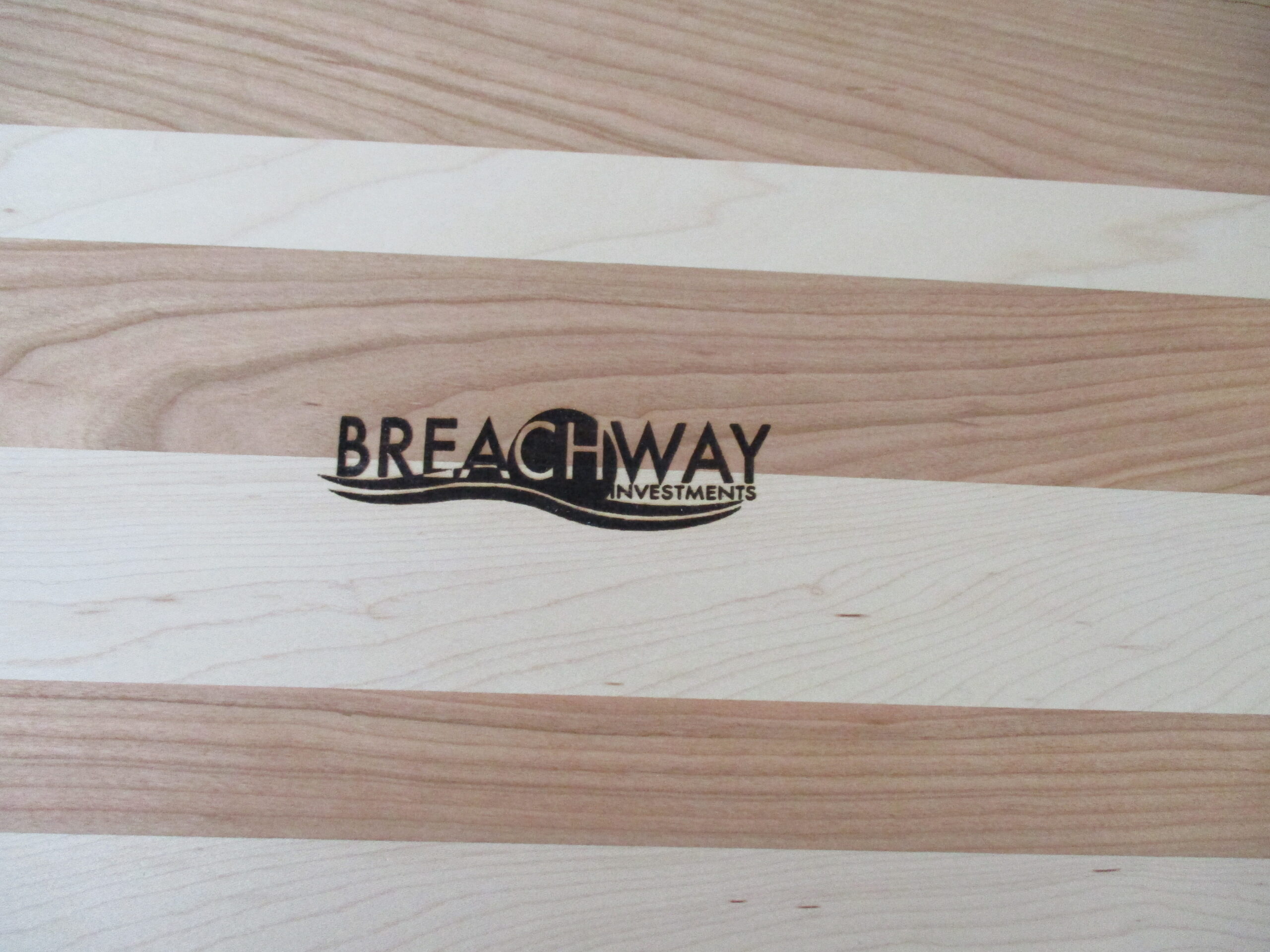 Company logo engraved on Maple and Cherry cutting board/charcuterie board as a promotional gift