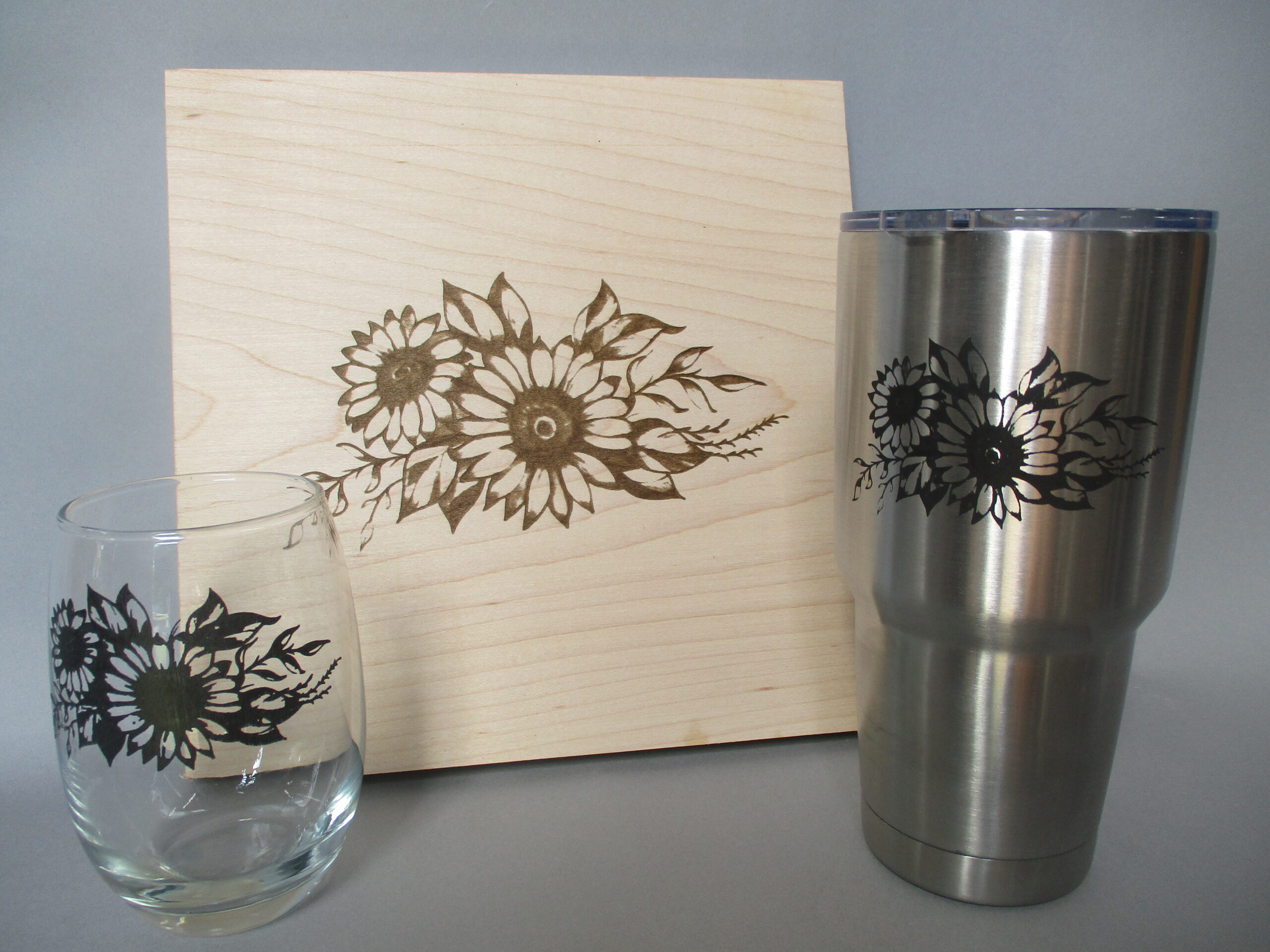 Laser engraved glass, tumbler, and trivet as a birthday gift.